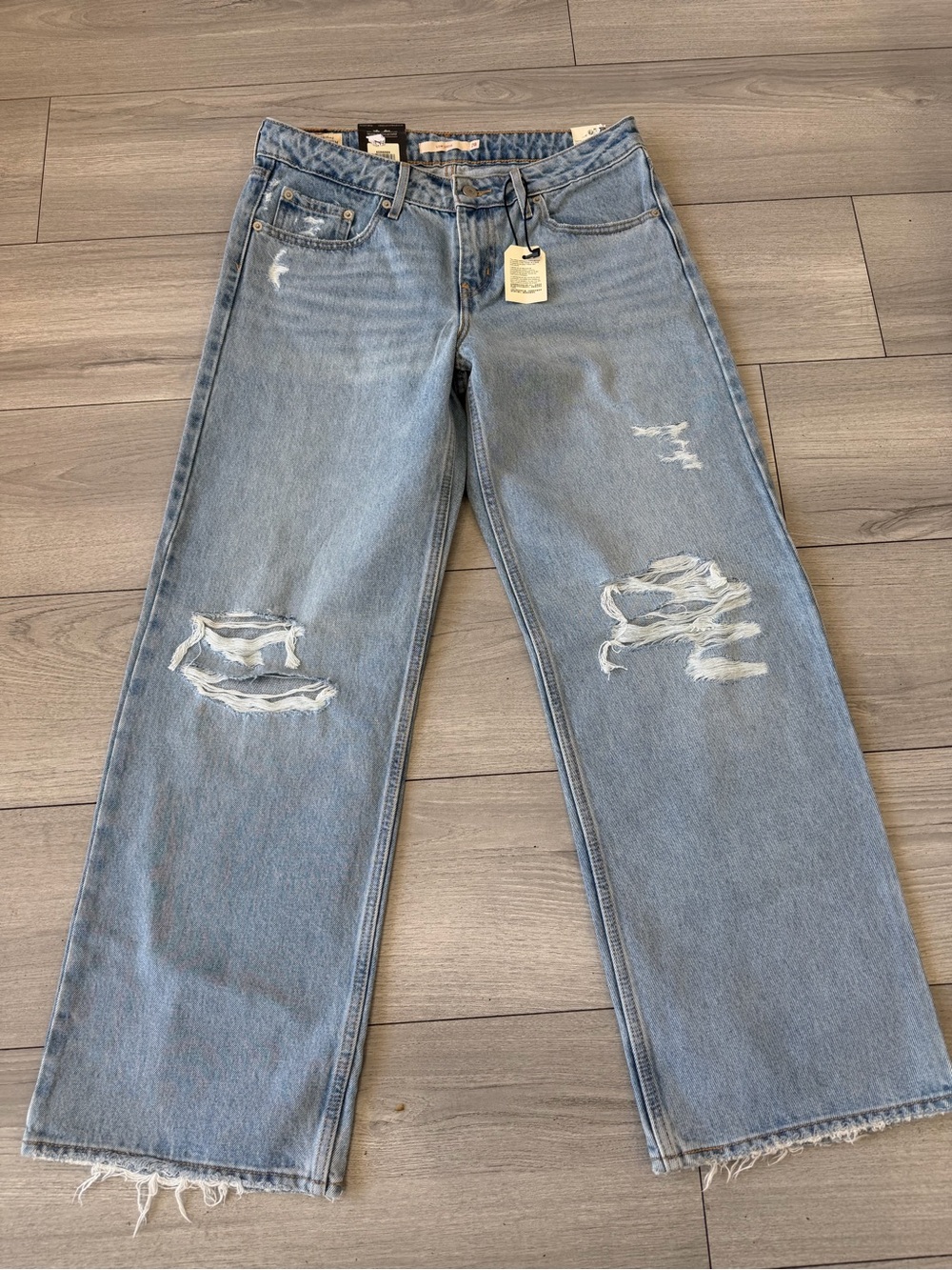 Low loose A low rise straight leg Light Wash Distressed Wide Leg Jeans